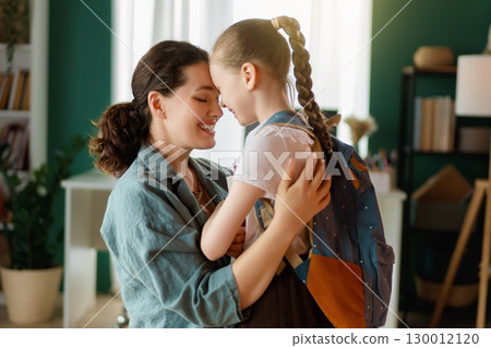 Happy family preparing for school 130012120