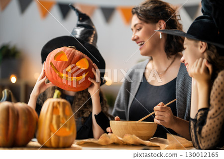 Happy family preparing for Halloween Happy family preparing for Halloween 130012165