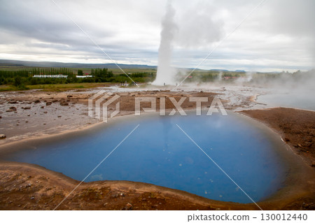 The Nordic island nation of Iceland - the blue pond of Geysir and Strokkur geyser in the Golden Circle The Nordic island nation of Iceland - the blue pond of Geysir and Strokkur geyser in the Golden Circle 130012440