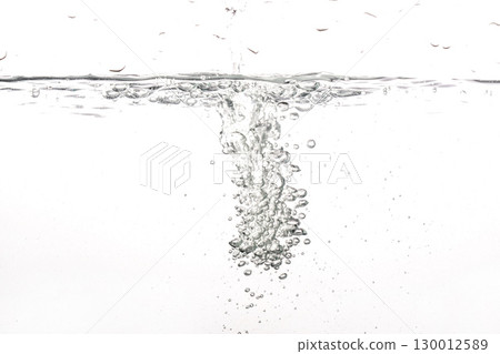 Water poured into tank, bubbles and splashes visible on white background 130012589