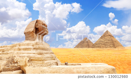 Horizontal banner with Sphinx and pyramid of Chephren and Cheops, Cairo, Egypt. Topic of travel, trip abroad on vacation, cruises and tours. Great Pyramids and statue of Sphinx, Giza Necropolis 130012980