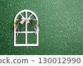 Little decorative wooden window with lace bow and flower on green stucco wall. Home sweet home style background. Charming wood window adorned with lace-trimmed bow and flower. Copy space for text 130012990