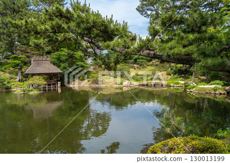 Traditional bridges in Shukkei-en Japanese garden in Hiroshima, Japan Traditional bridges in Shukkei-en Japanese garden in Hiroshima, Japan 130013199