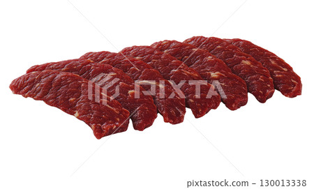 Fresh cuts of red meat arranged neatly for preparation or presentation in a culinary setting 130013338