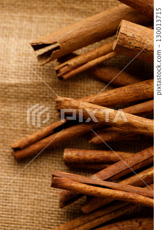 Cinnamon sticks dried tree bark spice on rustic background. Cinnamon sticks dried tree bark spice on rustic background. 130013715