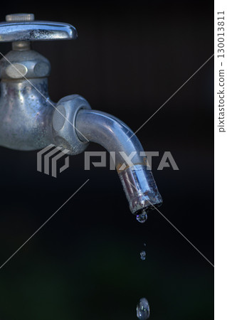 Water drops falling from the faucet 130013811