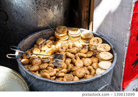 Preserved vegetable and meat crispy biscuits are authentic Anhui delicacy and available for sale in Hongchun village 130013899
