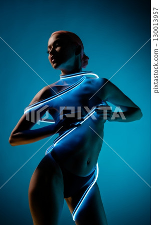 Striking beauty poses in alluring light with creative use of neon elements Striking beauty poses in alluring light with creative use of neon elements 130013957