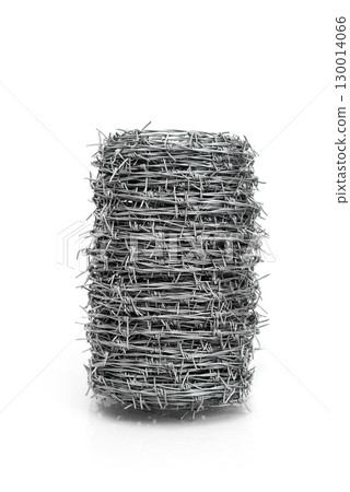 Roll of barbed wire isolated on white background, symbol of security, protection, and restriction. Roll of barbed wire isolated on white background, symbol of security, protection, and restriction. 130014066