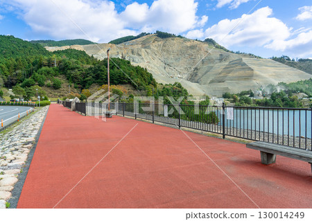 Koka City, Shiga Prefecture: A walking path overlooking the Aodo Dam with its two spillways Koka City, Shiga Prefecture: A walking path overlooking the Aodo Dam with its two spillways 130014249