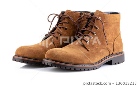 Pair of stylish brown suede boots isolated on white background Pair of stylish brown suede boots isolated on white background 130015213