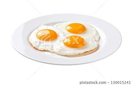 Three appetizing fried eggs are served on a white plate 130015241