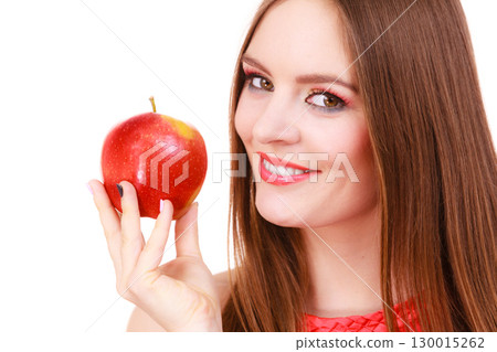 Woman charming girl colorful makeup holds apple fruit Woman charming girl colorful makeup holds apple fruit 130015262