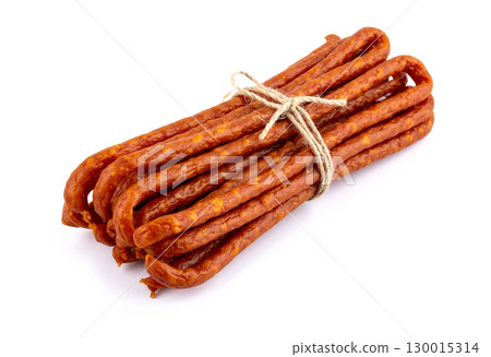 Bundle of kabanos sausages tied with string lying on white background Bundle of kabanos sausages tied with string lying on white background 130015314