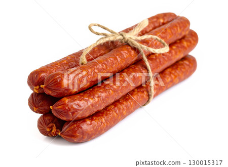 Bunch of thin sausages tied with string lying on white background 130015317