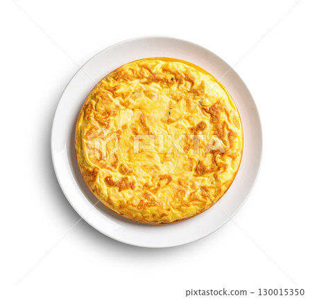 Spanish omelette with potatoes and onions, resting on white plate with transparent background 130015350
