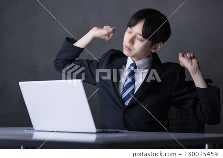 Young businessman working on a computer 130015459