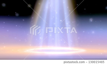 Black stage lit by spotlight 130015485