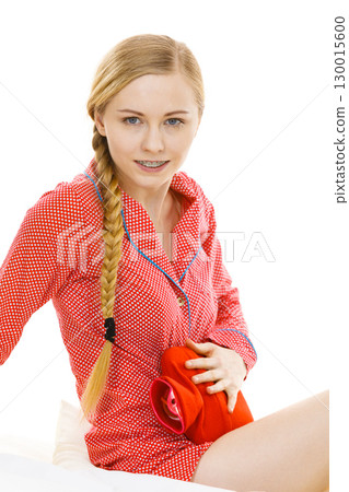 Woman feeling stomach cramps lying on bed Woman feeling stomach cramps lying on bed 130015600