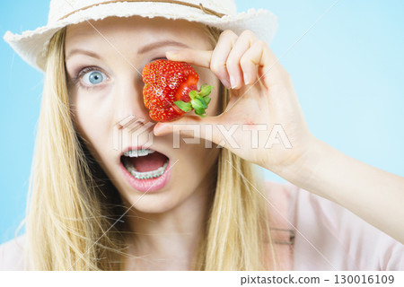 Young woman with fresh strawberries Young woman with fresh strawberries 130016109