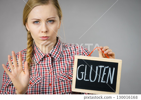 Woman holding board with gluten sign Woman holding board with gluten sign 130016168