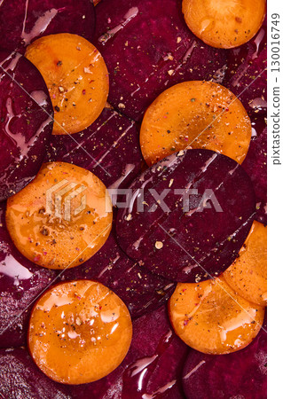 Sliced beetroot and persimmon salad with seasoning and oil Sliced beetroot and persimmon salad with seasoning and oil 130016749