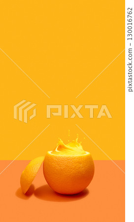 Orange with splash of juice in half peel on orange background Orange with splash of juice in half peel on orange background 130016762