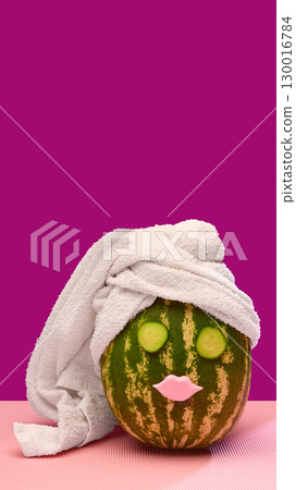 Watermelon spa face with towel wrap and cucumber slices Watermelon spa face with towel wrap and cucumber slices 130016784