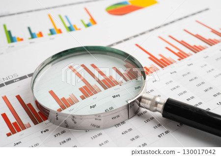 Magnifying glass on charts graphs paper. Financial development, Banking Account, Statistic, Investment Analytic research data economy. Magnifying glass on charts graphs paper. Financial development, Banking Account, Statistic, Investment Analytic research data economy. 130017042
