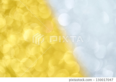 Abstract yellow and white bokeh background with circular light patterns and soft 130017047