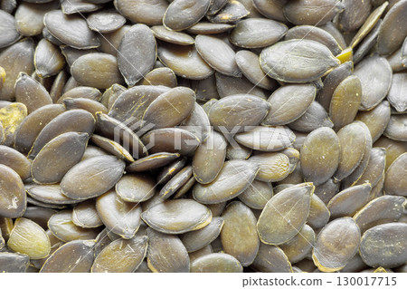Close up photo of peeled pumpkin seeds, selective focus. 130017715