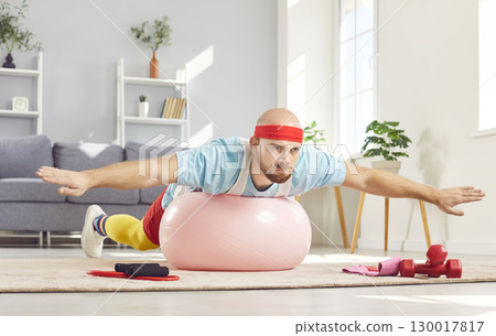 Funny Bald Man In 90s Tracksuit Using Fitball For Home Fitness Funny Bald Man In 90s Tracksuit Using Fitball For Home Fitness 130017817