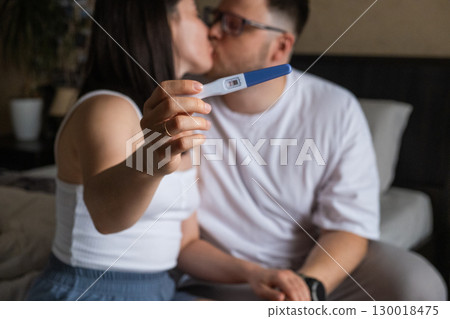 Happy Couple Celebrating Positive Pregnancy Test Happy Couple Celebrating Positive Pregnancy Test 130018475