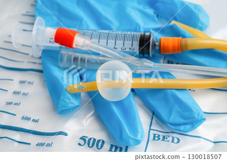 Foley catheter and urine drainage bag collect urine for disability or patient in hospital. Foley catheter and urine drainage bag collect urine for disability or patient in hospital. 130018507