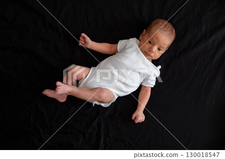 Newborn Baby on Black Background 130018547