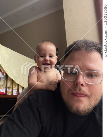 Playful Bonding Time with Baby and Dad 130018580