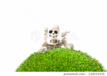 Human skeleton lying on front with legs up on moss Human skeleton lying on front with legs up on moss 130019330