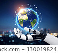 Robot hand holding the Earth 130019824