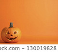 Jack-o'-lantern large face orange background Halloween copy space 130019828