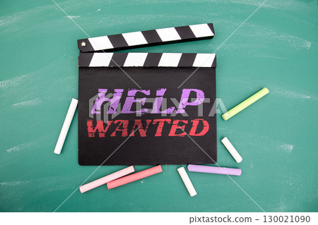 Help Wanted Message on Movie Clapperboard with Chalk on Green Blackboard Background Help Wanted Message on Movie Clapperboard with Chalk on Green Blackboard Background 130021090