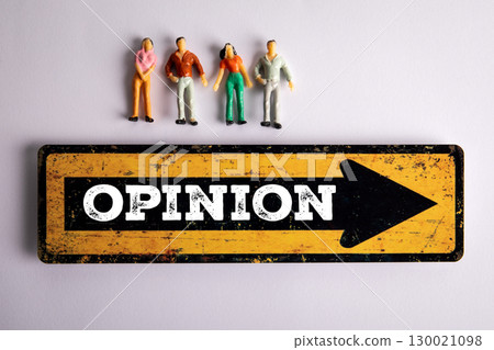 Public Opinion Concept with Miniature People and Directional Sign on Light Background 130021098