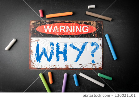 Questioning Concept with Warning Sign and Chalks Emphasizing the Word Why on Blackboard Questioning Concept with Warning Sign and Chalks Emphasizing the Word Why on Blackboard 130021101