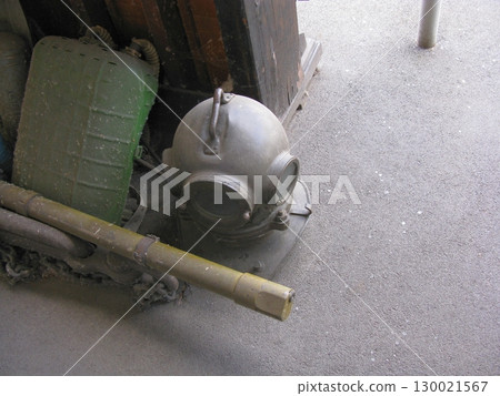 Antique Diving Helmet and Gear Setup with Oxygen Tank and Wooden Crate 130021567