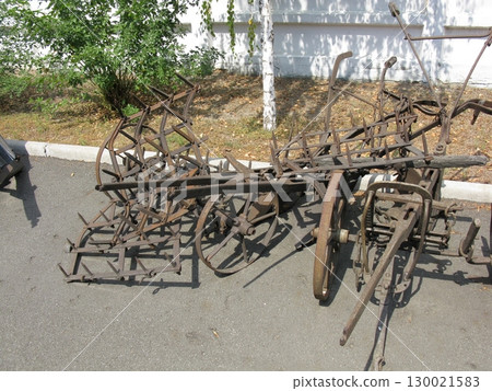 Vintage Agricultural Harrow with Metal Tines Displayed in an Outdoor Environment 130021583