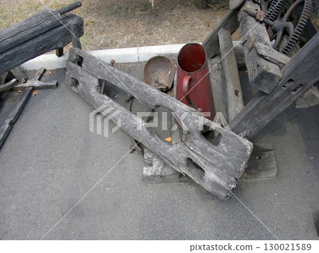 Vintage Wooden Yoke with Attached Metal Containers in Outdoor Setting Vintage Wooden Yoke with Attached Metal Containers in Outdoor Setting 130021589