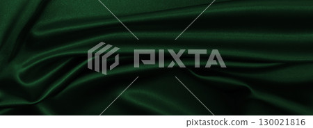 Smooth elegant green silk or satin luxury cloth texture as abstract background. Luxurious background design Smooth elegant green silk or satin luxury cloth texture as abstract background. Luxurious background design 130021816