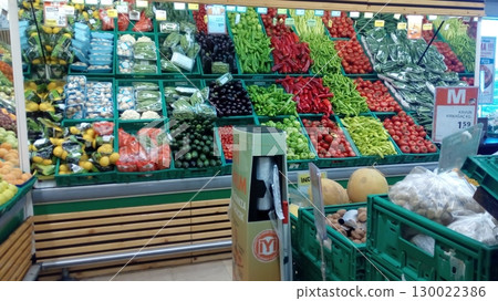 A Vibrant Vegetable Market Display with a Wide Variety of Fresh Produce in Green Crates A Vibrant Vegetable Market Display with a Wide Variety of Fresh Produce in Green Crates 130022386