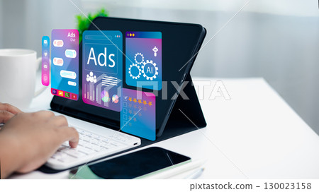 Person using tablet with digital ads, AI, social media, and data analysis interfaces symbolizing online advertising and modern marketing technology 130023158
