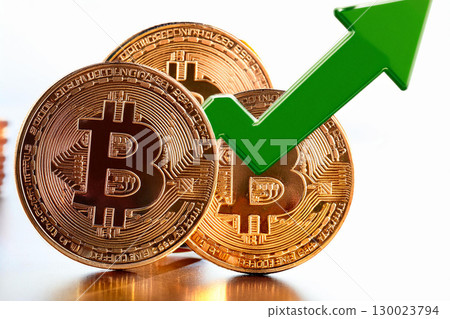 Three Bitcoin Coins Positioned With a Green Upward Arrow Symbolizing Growth and Success 130023794