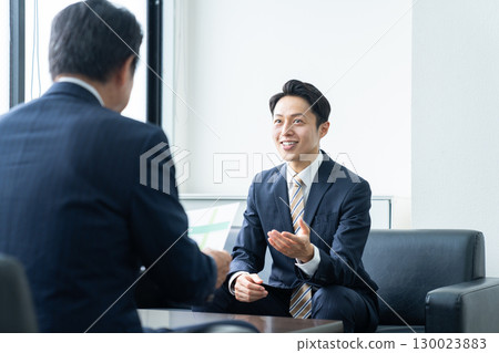 Middle-aged businessman working in the office 130023883